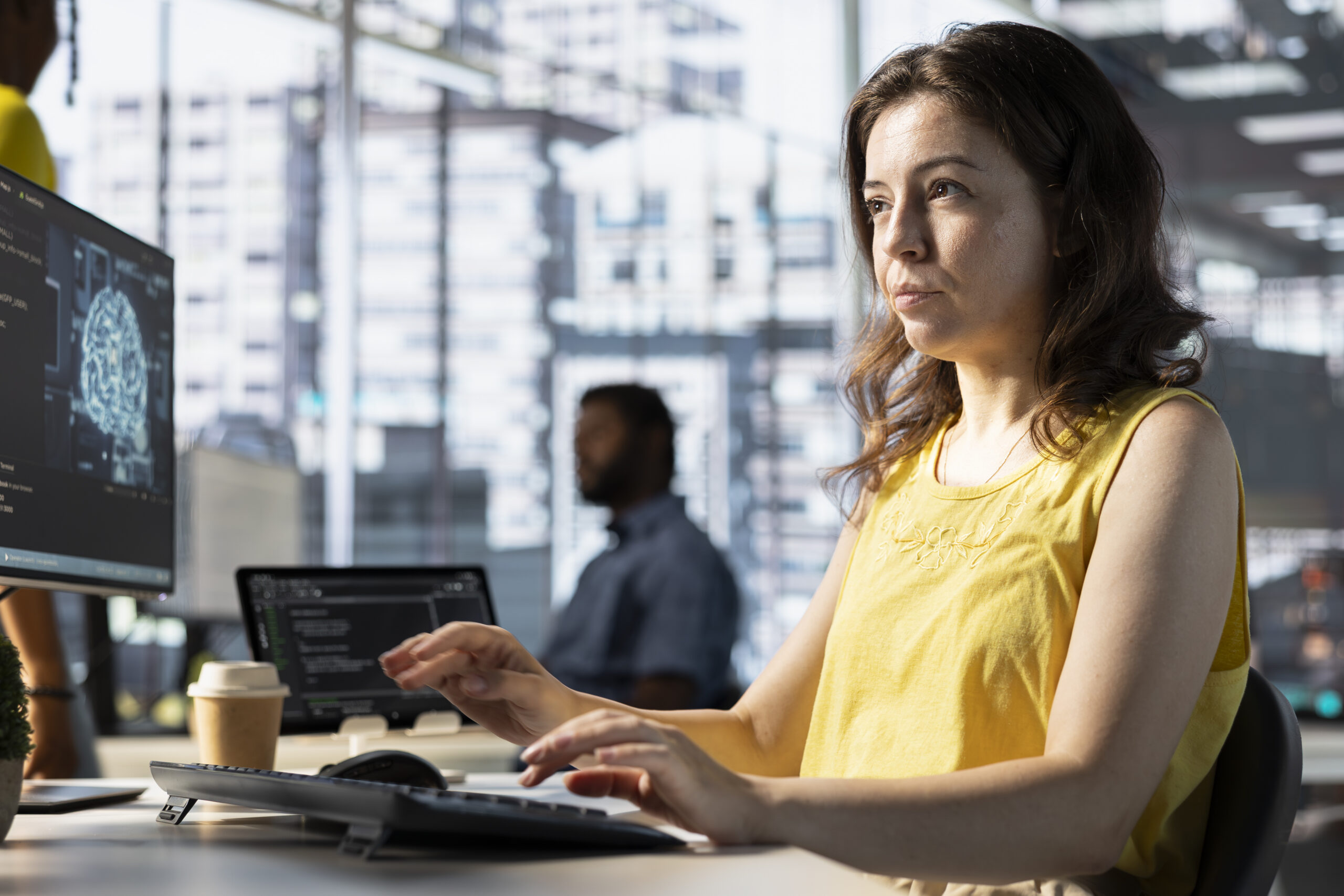 Software engineer doing job, creating machine learning models that can process and analyze data to automate decision making processes. Focused IT specialist programming in workspace using PC